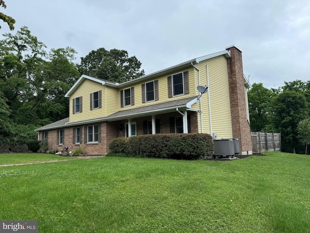 400 27th St, Huntingdon, PA 16652 - view of front facade with a chimney and brick siding