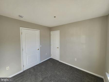 337 Nicholas Dr, Riverside, NJ 08075 - spare room with dark carpet and a smoke detector