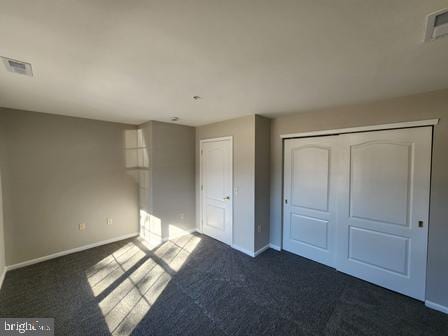 337 Nicholas Dr, Riverside, NJ 08075 - unfurnished bedroom with dark carpet and a closet