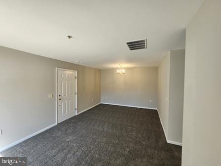 337 Nicholas Dr, Riverside, NJ 08075 - empty room with a chandelier and dark colored carpet