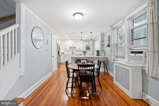 1123 Maple St, Conshohocken, PA 19428 - dining area featuring wood-type flooring, recessed lighting, crown molding, and cooling unit