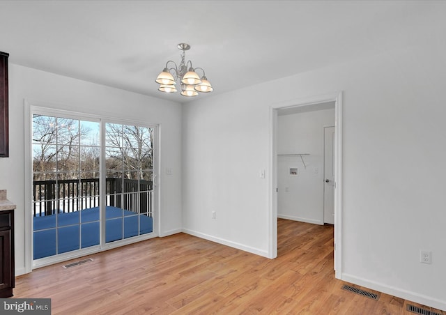 21 American Ave, Carlisle, PA 17013 - unfurnished dining area featuring a chandelier and light wood finished floors