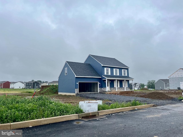 21 American Ave, Carlisle, PA 17013 - view of front of property with covered porch, a garage, roof with shingles, and a residential view