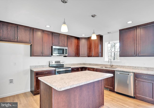 21 American Ave, Carlisle, PA 17013 - kitchen featuring stainless steel appliances, light countertops, light wood-style flooring, recessed lighting, and pendant lighting