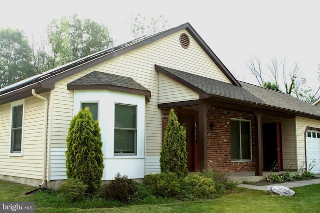 161 Carlton Ave, Marlton, NJ 08053 - view of front of house with roof with shingles, a garage, and brick siding