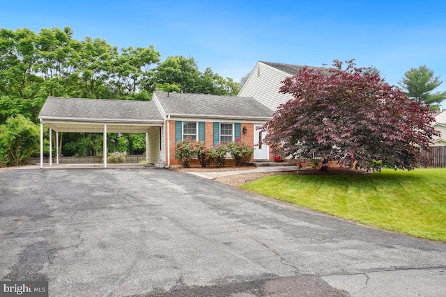 13 Gelding Ct, Olney, MD 20832 - view of front of property featuring a front lawn, driveway, a carport, and roof with shingles