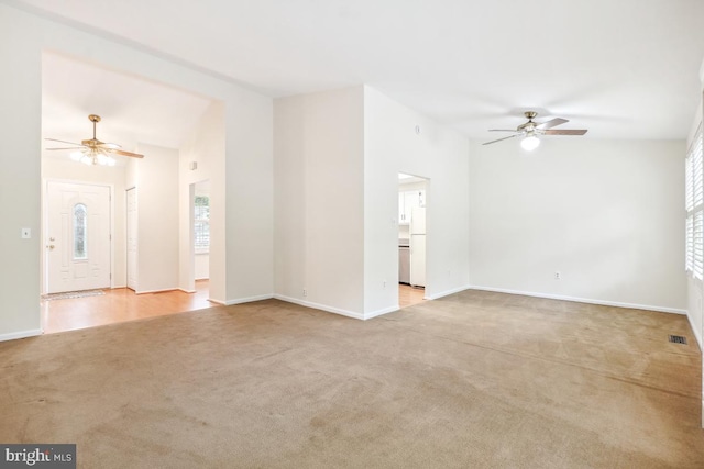 13 Gelding Ct, Olney, MD 20832 - unfurnished living room featuring ceiling fan, light carpet, healthy amount of natural light, and vaulted ceiling