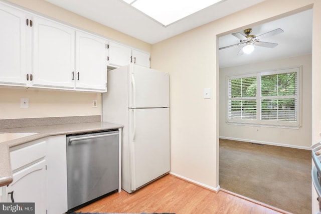 13 Gelding Ct, Olney, MD 20832 - kitchen with freestanding refrigerator, stainless steel dishwasher, white cabinets, light countertops, and a ceiling fan