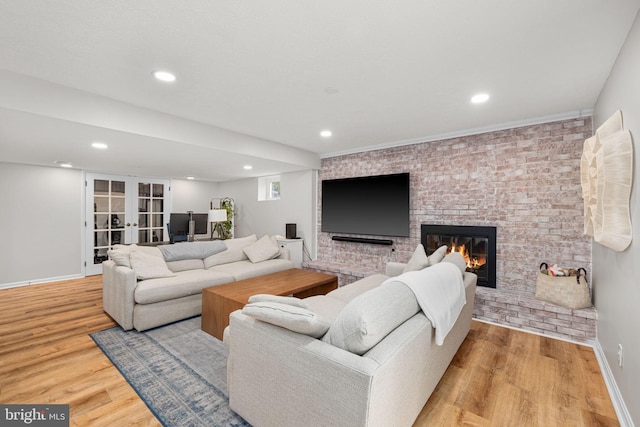 4301 Ivanhoe Pl, Alexandria, VA 22304 - living area with wood finished floors, a fireplace, recessed lighting, and french doors