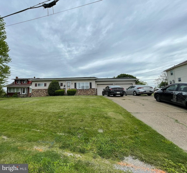 1105 Darlington Rd, Beaver Falls, PA 15010 - view of front of home featuring a garage, driveway, stone siding, and a front lawn