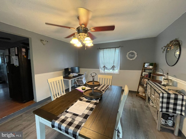 1105 Darlington Rd, Beaver Falls, PA 15010 - dining room with wood finished floors, a ceiling fan, and wainscoting