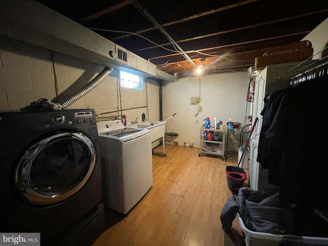 1105 Darlington Rd, Beaver Falls, PA 15010 - washroom featuring washing machine and dryer and light wood-type flooring