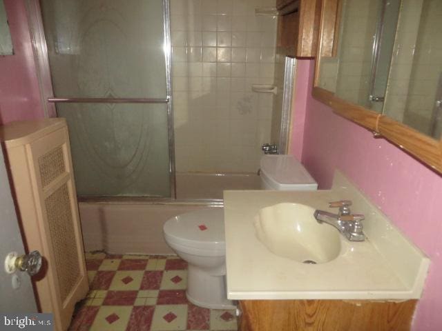 5505 Loretto Ave, Philadelphia, PA 19124 - full bath with tile patterned floors, bath / shower combo with glass door, and vanity