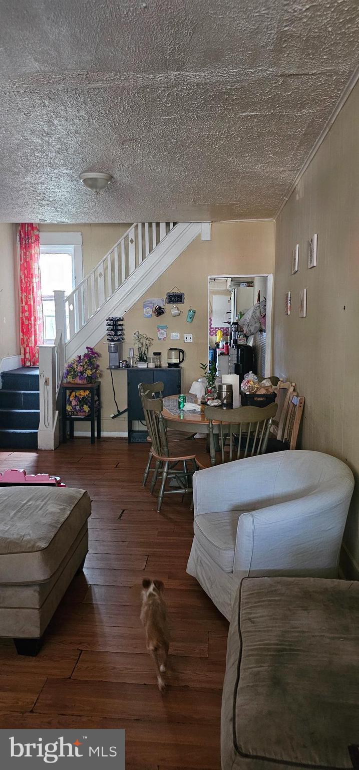 441 Garfield Ave, Trenton, NJ 08629 - dining space featuring stairs, hardwood / wood-style floors, and a textured ceiling