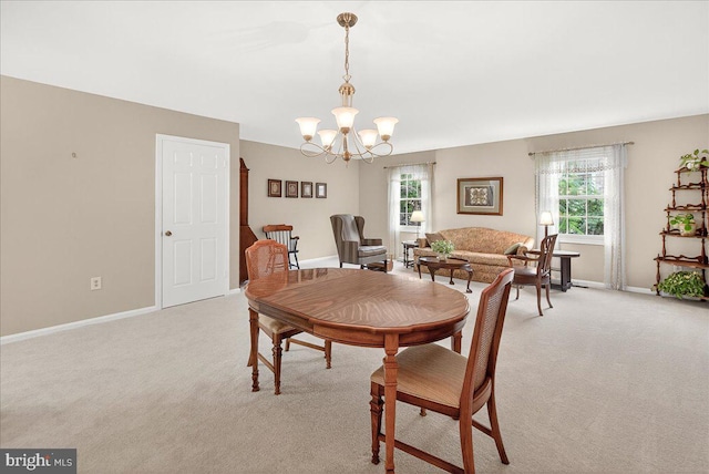 7504 Westlake Ter Unit 25, Bethesda, MD 20817 - dining space with light carpet, healthy amount of natural light, and a chandelier