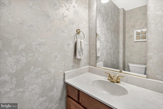 7504 Westlake Ter Unit 25, Bethesda, MD 20817 - half bath with vanity and wallpapered walls