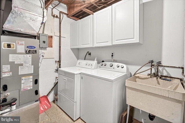 7504 Westlake Ter Unit 25, Bethesda, MD 20817 - laundry area featuring cabinet space, independent washer and dryer, concrete block wall, and heating unit