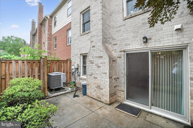 7504 Westlake Ter Unit 25, Bethesda, MD 20817 - back of house with a patio area and brick siding