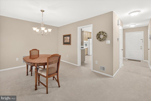 7504 Westlake Ter Unit 25, Bethesda, MD 20817 - dining area with a chandelier and light colored carpet
