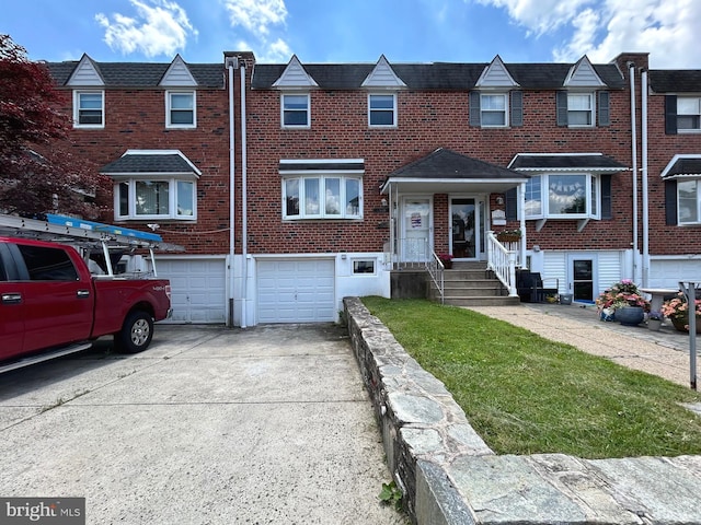 12621 Chilton Rd, Philadelphia, PA 19154 - view of property featuring a garage, driveway, and brick siding