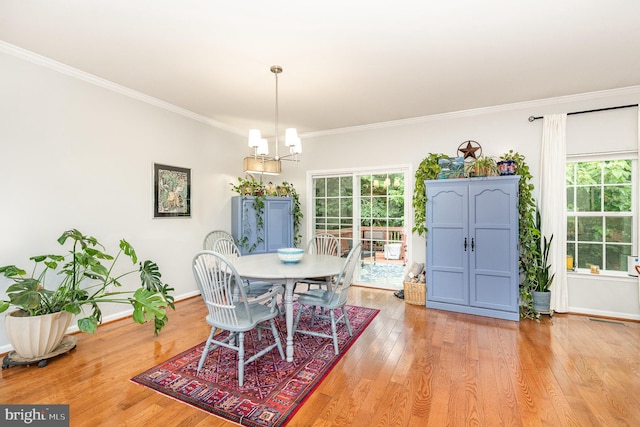 1404 Preserve Ln, Fredericksburg, VA 22401 - dining area with crown molding, light wood-style flooring, and a chandelier