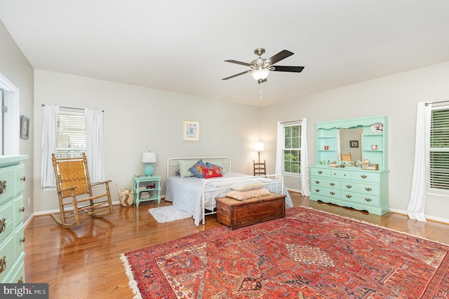 1404 Preserve Ln, Fredericksburg, VA 22401 - bedroom featuring wood finished floors, multiple windows, and ceiling fan