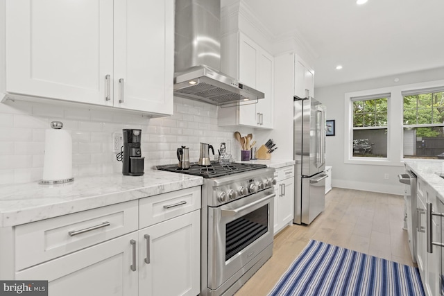 2819 Bellevue Ter NW, Washington, DC 20007 - kitchen featuring wall chimney range hood, stainless steel appliances, white cabinetry, decorative backsplash, and recessed lighting