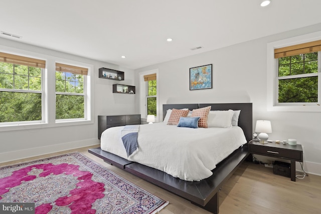 2819 Bellevue Ter NW, Washington, DC 20007 - bedroom with multiple windows, wood finished floors, and recessed lighting