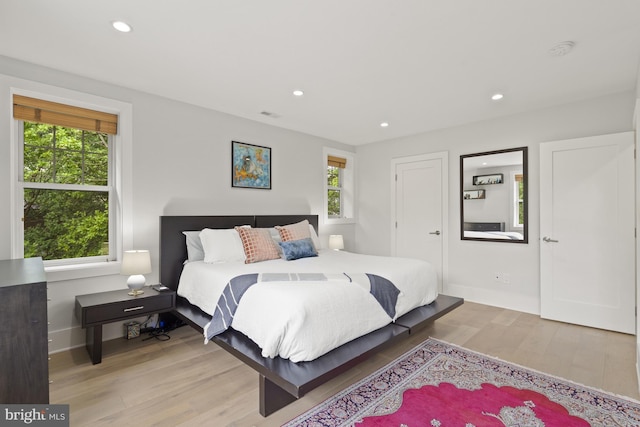 2819 Bellevue Ter NW, Washington, DC 20007 - bedroom featuring multiple windows, light wood-style floors, and recessed lighting