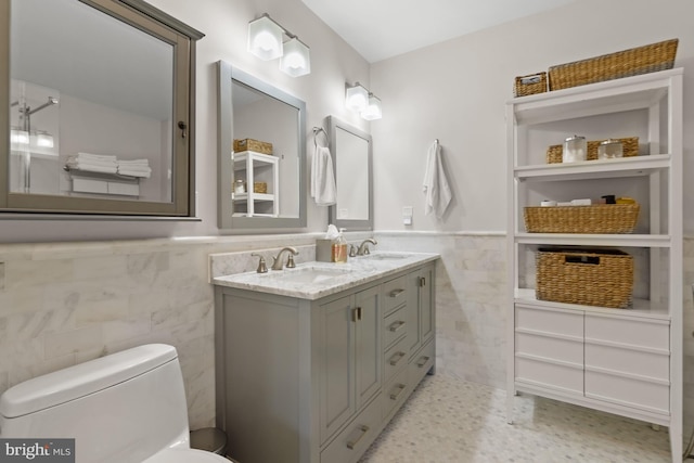 2819 Bellevue Ter NW, Washington, DC 20007 - bathroom with tile walls, a wainscoted wall, and double vanity