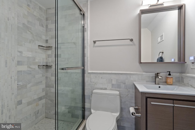 2819 Bellevue Ter NW, Washington, DC 20007 - full bath featuring vanity, a shower stall, a wainscoted wall, and tile walls