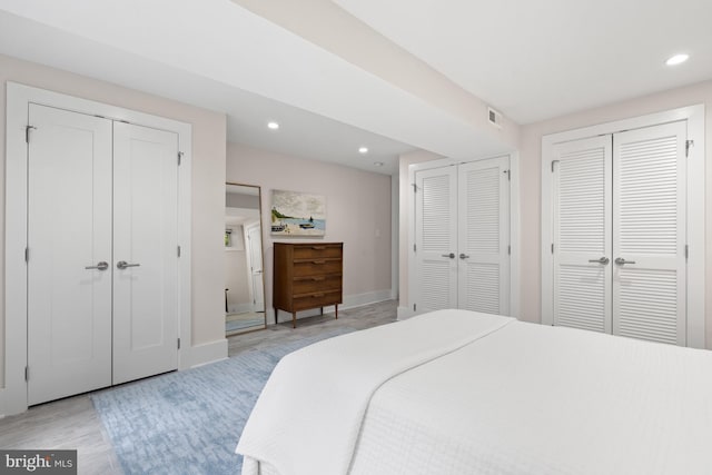 2819 Bellevue Ter NW, Washington, DC 20007 - bedroom featuring two closets, recessed lighting, and light wood-style floors