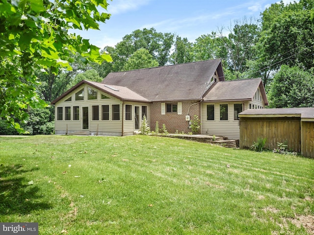 258 Merrimack, Falling Waters, WV 25419 - back of property with a yard, roof with shingles, and brick siding