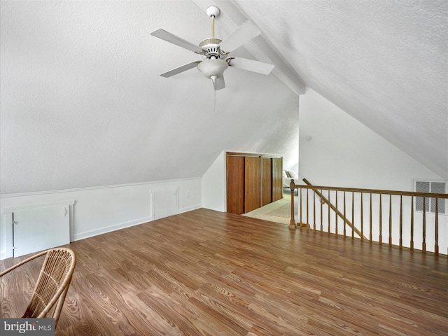 258 Merrimack, Falling Waters, WV 25419 - additional living space featuring wood finished floors, ceiling fan, and a textured ceiling