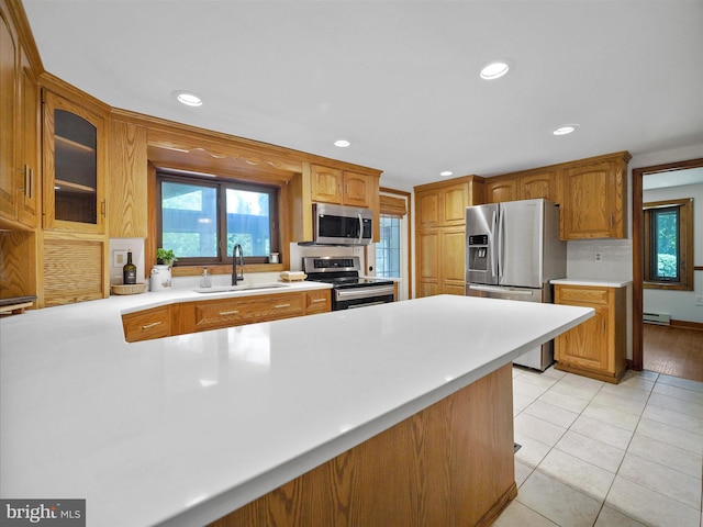 258 Merrimack, Falling Waters, WV 25419 - kitchen with stainless steel appliances, recessed lighting, light countertops, glass insert cabinets, and light tile patterned floors