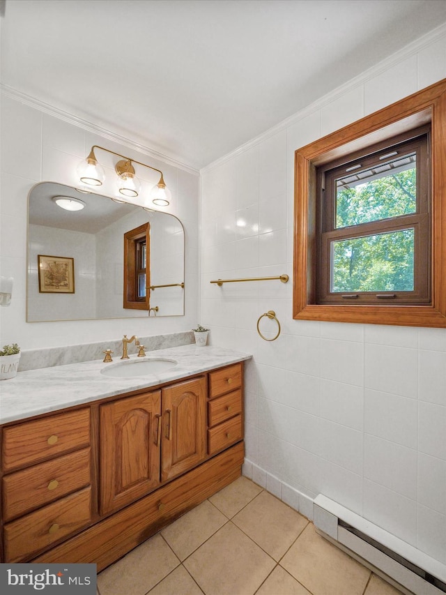 258 Merrimack, Falling Waters, WV 25419 - bathroom with baseboard heating, crown molding, vanity, tile walls, and tile patterned flooring