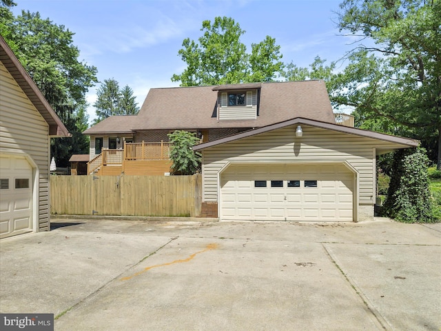 258 Merrimack, Falling Waters, WV 25419 - view of front of home with a garage, a shingled roof, brick siding, and driveway