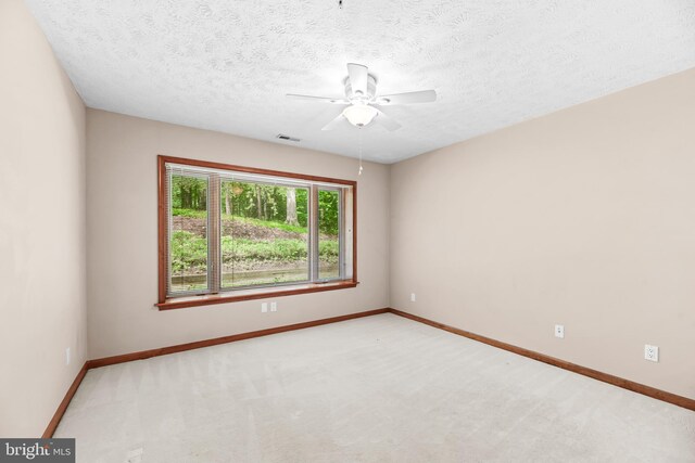 23140 Cobblestone Ln Unit 109, California, MD 20619 - unfurnished room with ceiling fan, carpet flooring, and a textured ceiling