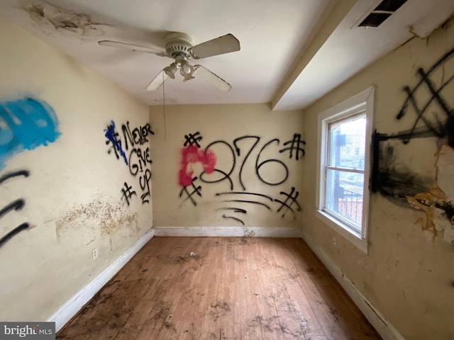 2110 N Charles St N, Baltimore, MD 21218 - unfurnished room featuring hardwood / wood-style floors and ceiling fan
