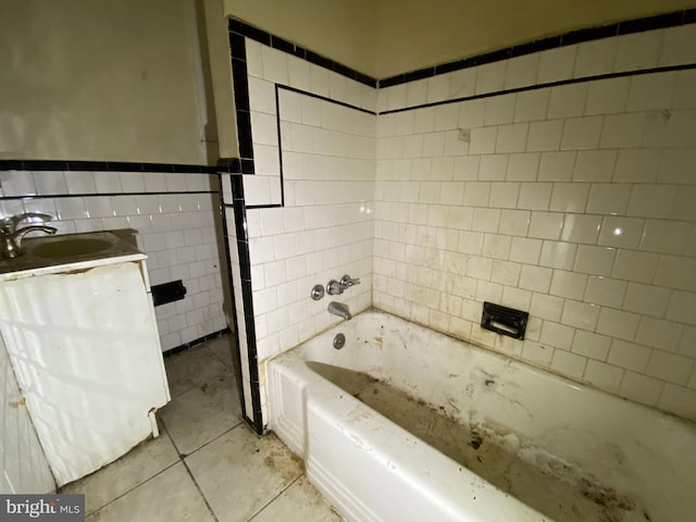 2110 N Charles St N, Baltimore, MD 21218 - full bathroom with tile walls, tile patterned flooring, vanity, and wainscoting
