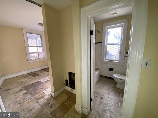 2110 N Charles St N, Baltimore, MD 21218 - full bath with tile walls and a tub