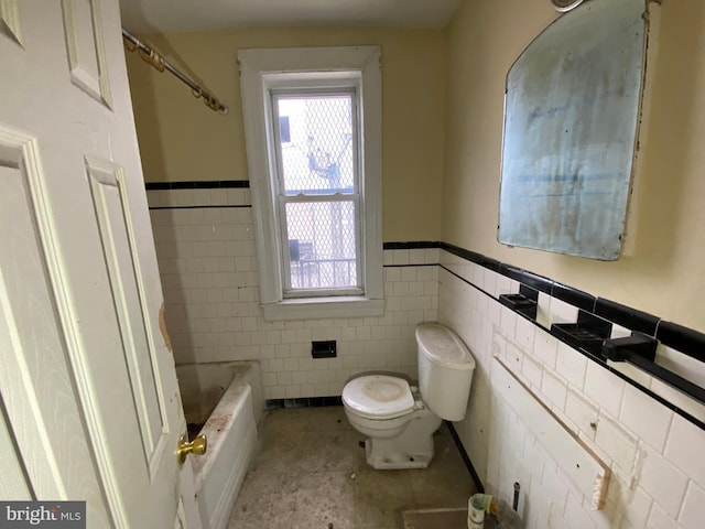 2110 N Charles St N, Baltimore, MD 21218 - full bathroom with tile walls, wainscoting, a bath, and tile patterned flooring
