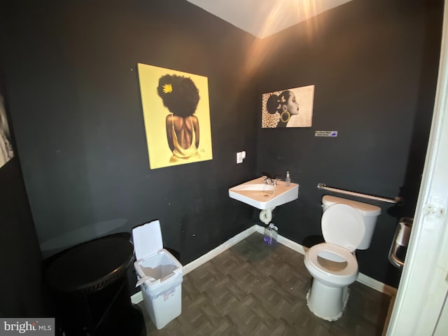 2110 N Charles St N, Baltimore, MD 21218 - bathroom featuring toilet and baseboards