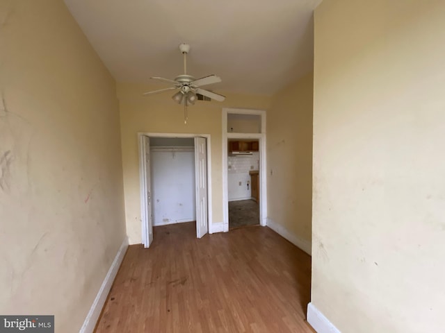 2110 N Charles St N, Baltimore, MD 21218 - unfurnished bedroom with wood finished floors and a closet