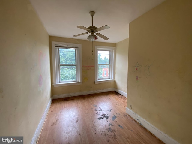2110 N Charles St N, Baltimore, MD 21218 - unfurnished room with wood finished floors and a ceiling fan