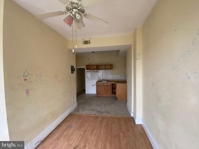 2110 N Charles St N, Baltimore, MD 21218 - unfurnished living room with light wood-type flooring and ceiling fan