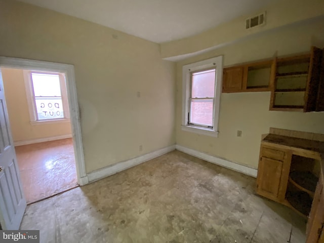 2110 N Charles St N, Baltimore, MD 21218 - unfurnished dining area featuring baseboards