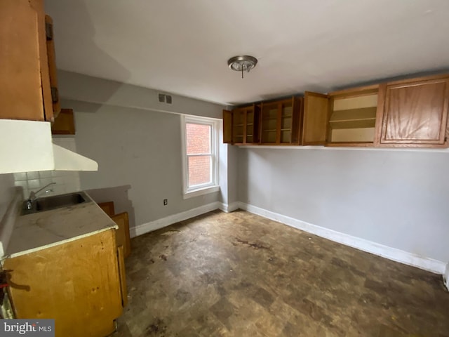 2110 N Charles St N, Baltimore, MD 21218 - kitchen featuring open shelves and brown cabinets