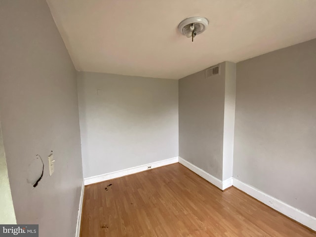 2110 N Charles St N, Baltimore, MD 21218 - unfurnished room with baseboards and wood finished floors