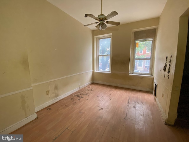 2110 N Charles St N, Baltimore, MD 21218 - spare room featuring light wood finished floors and ceiling fan